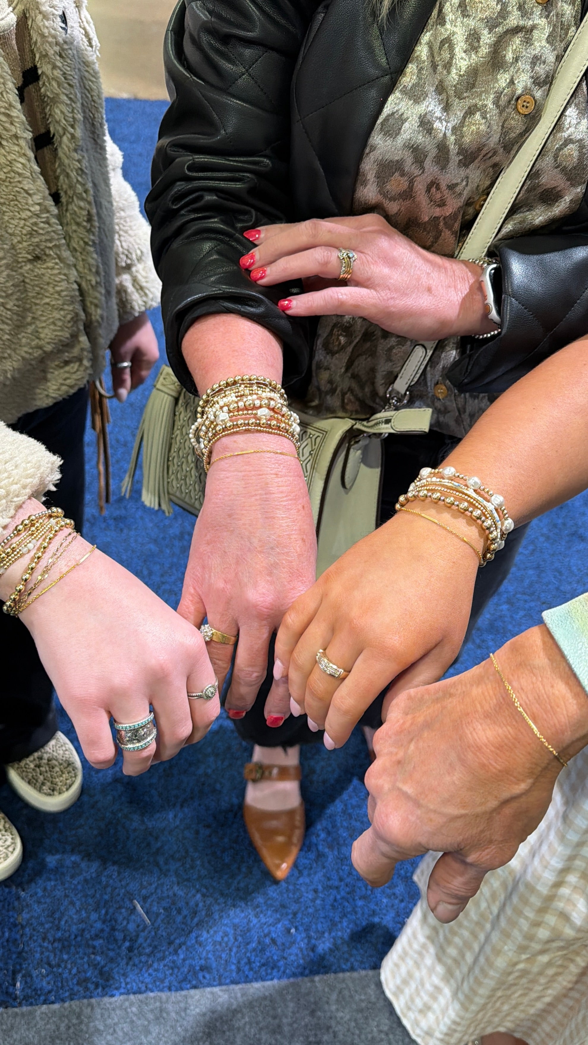 Close-up of hands with jewelry at an event